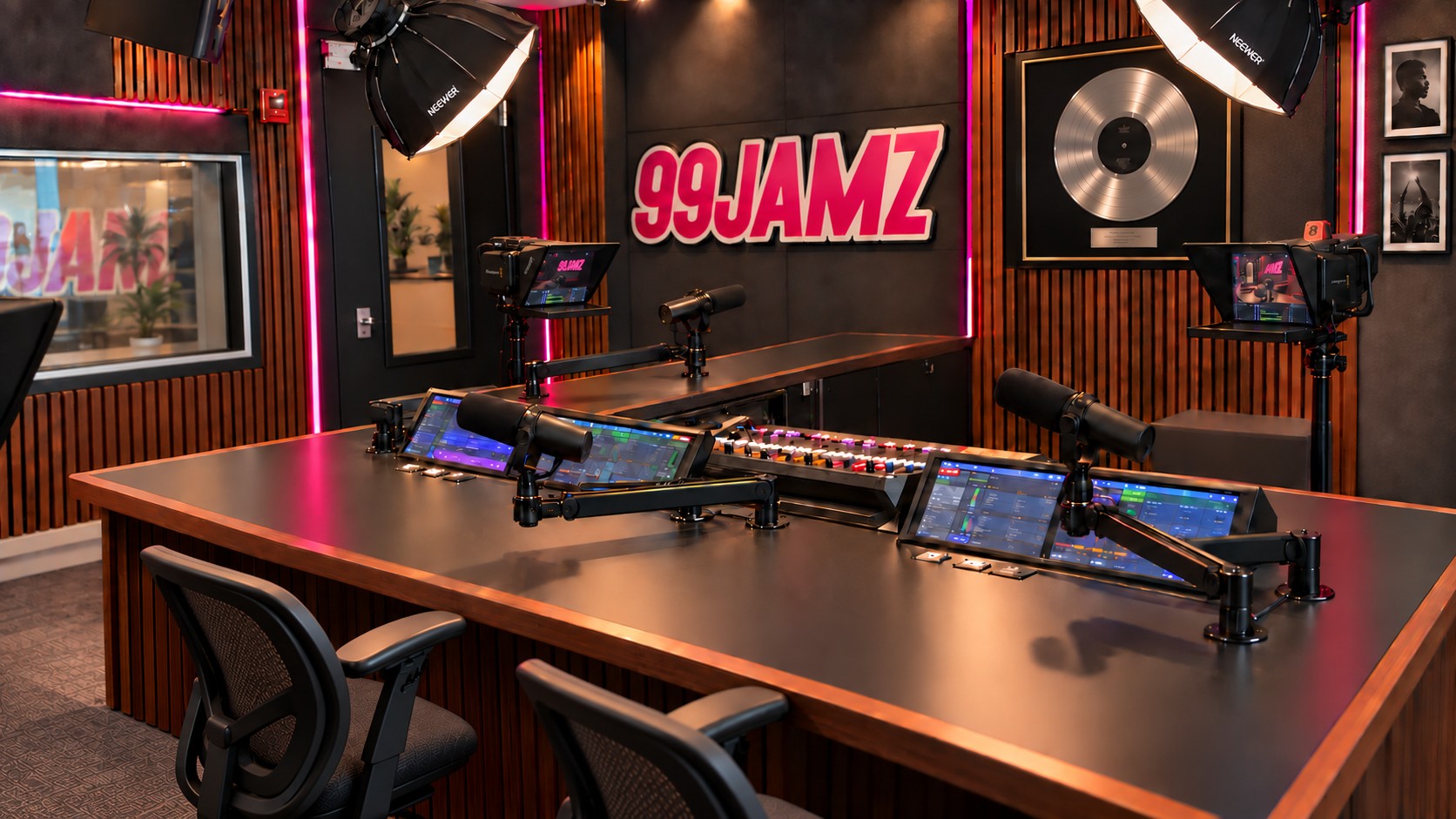 Radio studio concept with the existing console and desk layout, upgraded microphones, cameras and overhead lighting